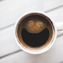 a cup of coffee on a table
