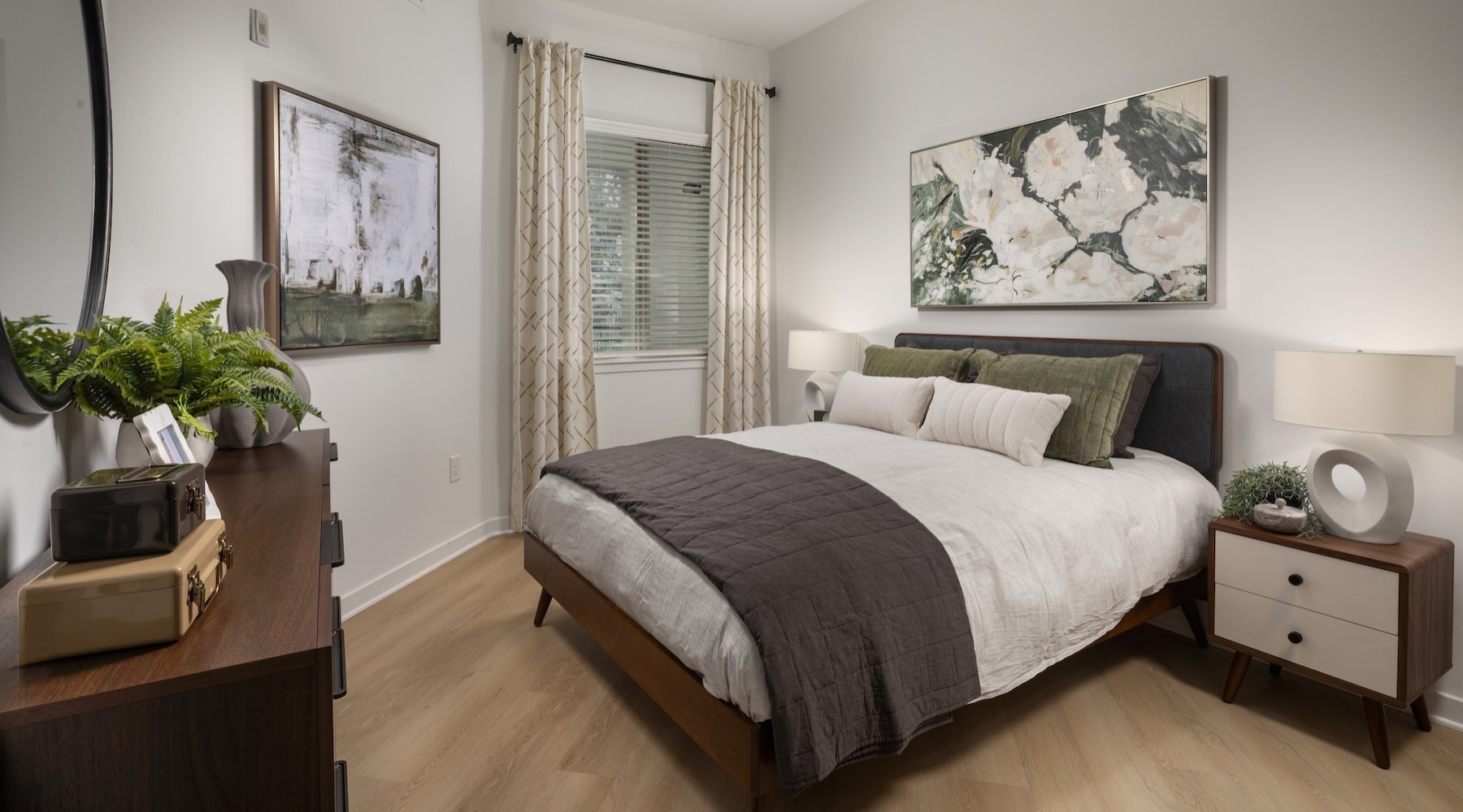 a bedroom with a bed and two nightstands