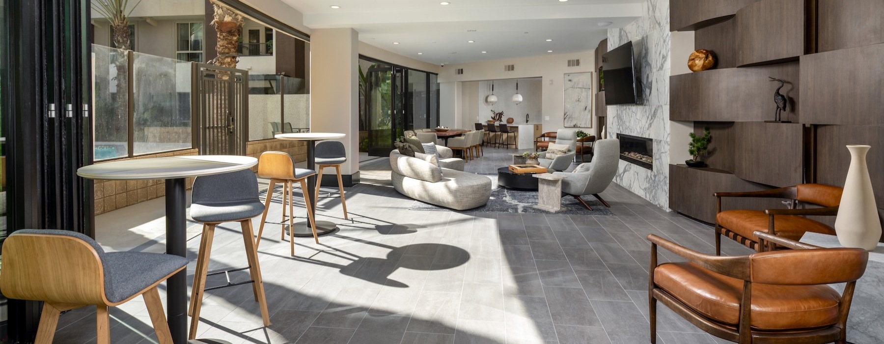 a clubroom with couches, tables and chairs