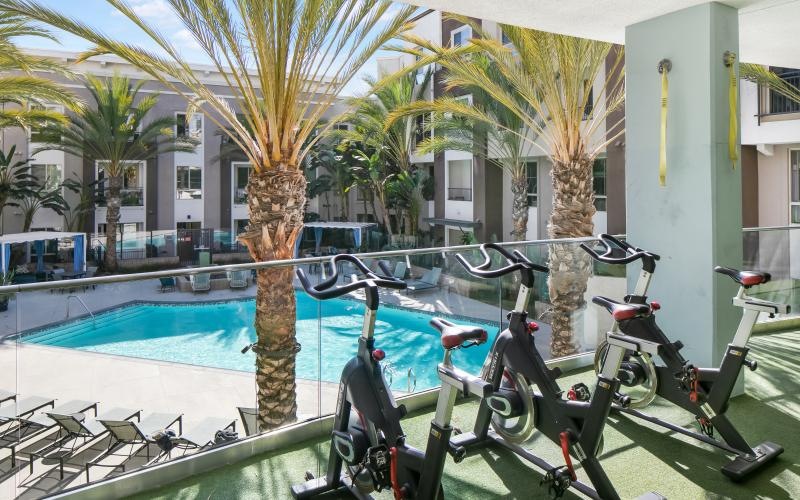 a couple of bikes parked by a pool